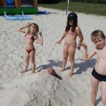 Children playing in the sand at Camping Pré des moines