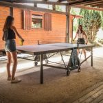 Girls playing table tennis at the Pré des moines campsite
